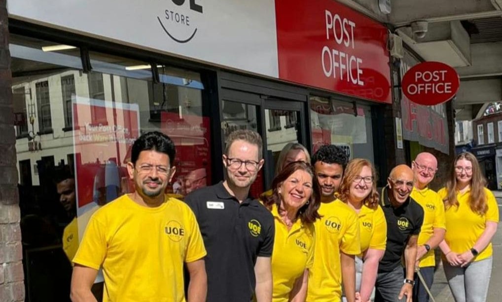 UOE Team members standing outside UOE Store